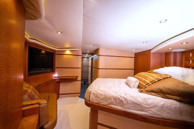 Slide: The Image of Luxurious 1997 Garlington Convertible yacht interior with cozy bedroom and modern amenities. - 8