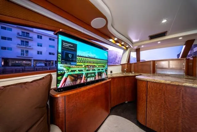 Slide: The Image of Luxurious interior of a 1997 Garlington Convertible yacht with modern amenities and elegant wood finishes. - 9