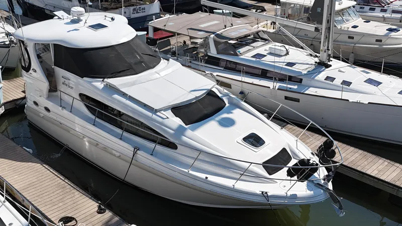 Slide: The Image of Interior of 2007 Sea Ray 40 Motor Yacht with modern amenities and wooden flooring. - 14