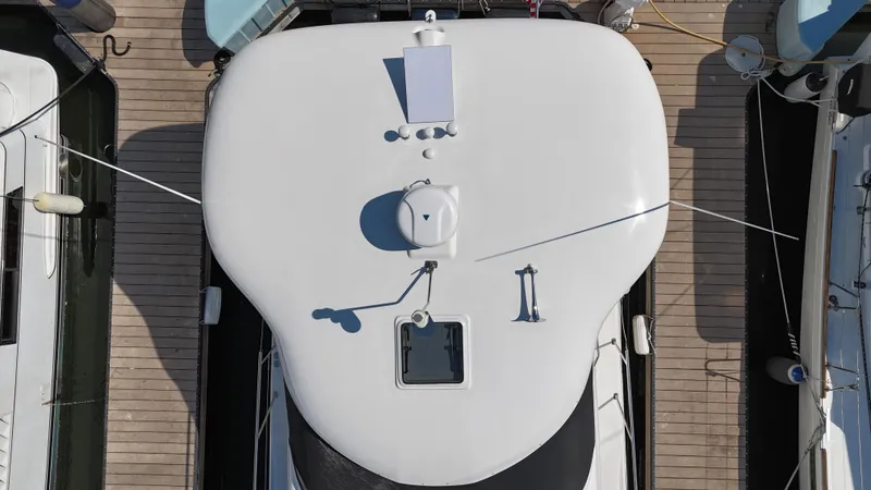 Slide: The Image of Interior of 2007 Sea Ray 40 Motor Yacht with white seating and wooden flooring. - 15