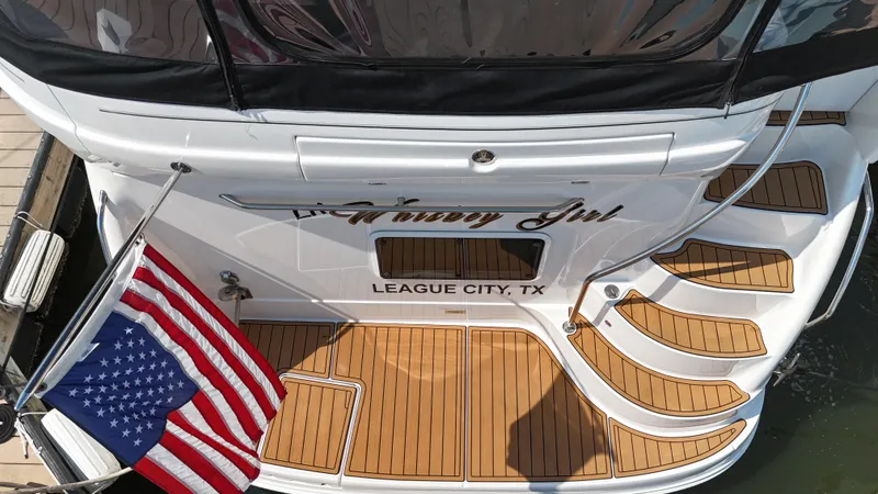 Slide: The Image of Luxurious 2007 Sea Ray 40 Motor Yacht interior with white seating and wooden flooring. - 16