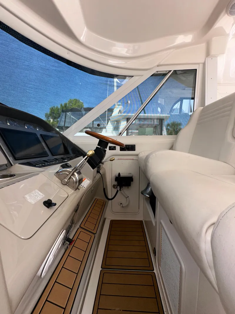 Slide: The Image of Control panel of 2007 Sea Ray 40 Motor Yacht with dual screens and gauges. - 24