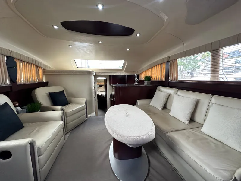 Slide: The Image of Luxurious interior of 2007 Sea Ray 40 Motor Yacht with elegant seating and table. - 30