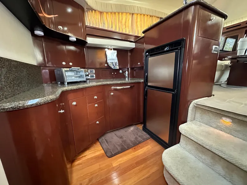 Slide: The Image of Luxurious 2007 Sea Ray 40 Motor Yacht cabin with cozy bedding and modern decor. - 37