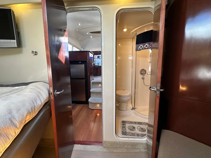 Slide: The Image of Luxurious bedroom interior of 2007 Sea Ray 40 Motor Yacht with elegant bedding. - 44