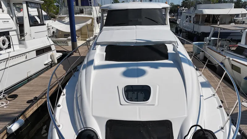 Slide: The Image of 2007 Sea Ray 40 Motor Yacht docked at marina, front view. - 5
