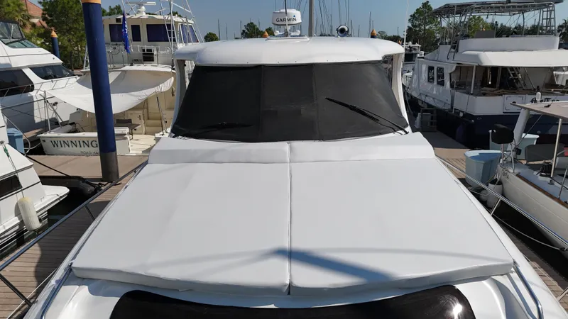 Slide: The Image of 2007 Sea Ray 40 Motor Yacht docked at marina, front view. - 6