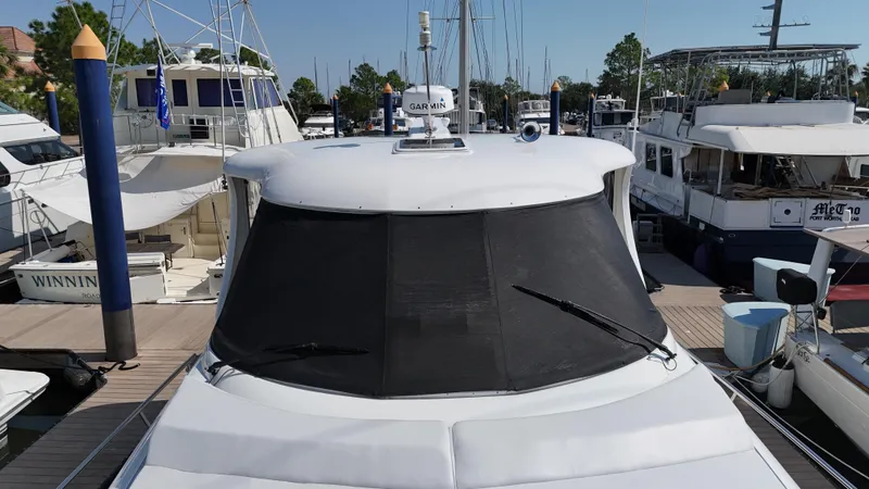 Slide: The Image of 2007 Sea Ray 40 Motor Yacht docked at marina, sleek white design. - 7