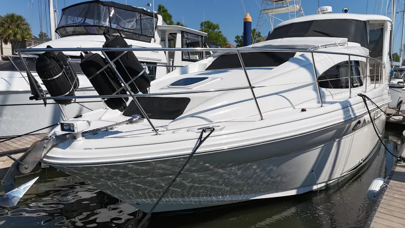 Slide: The Image of 2007 Sea Ray 40 Motor Yacht docked, featuring sleek design and American flag. - 8