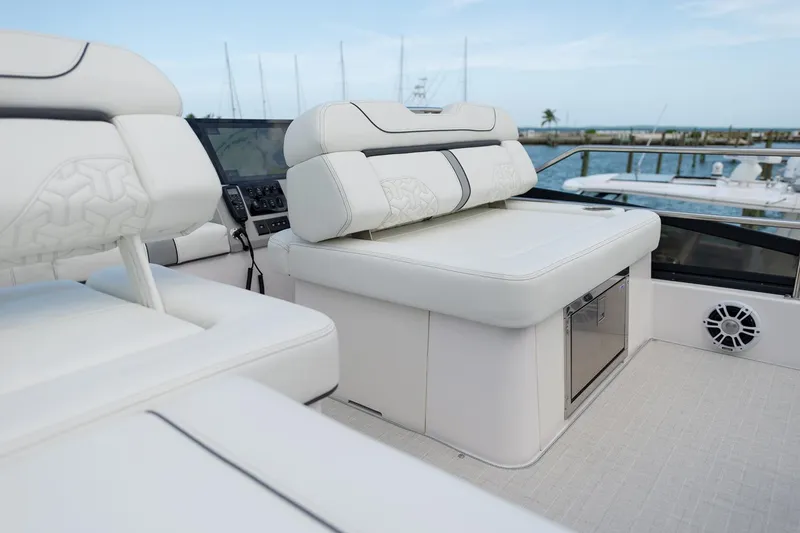 Slide: The Image of Manufacturer Provided Image: Luxurious seating on 2025 Regal 38 FXO yacht, featuring sleek white upholstery and modern design. - 107