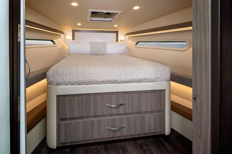 Slide: The Image of Manufacturer Provided Image: Luxurious cabin interior of 2025 Regal 38 FXO yacht with cozy bed and modern design. - 113