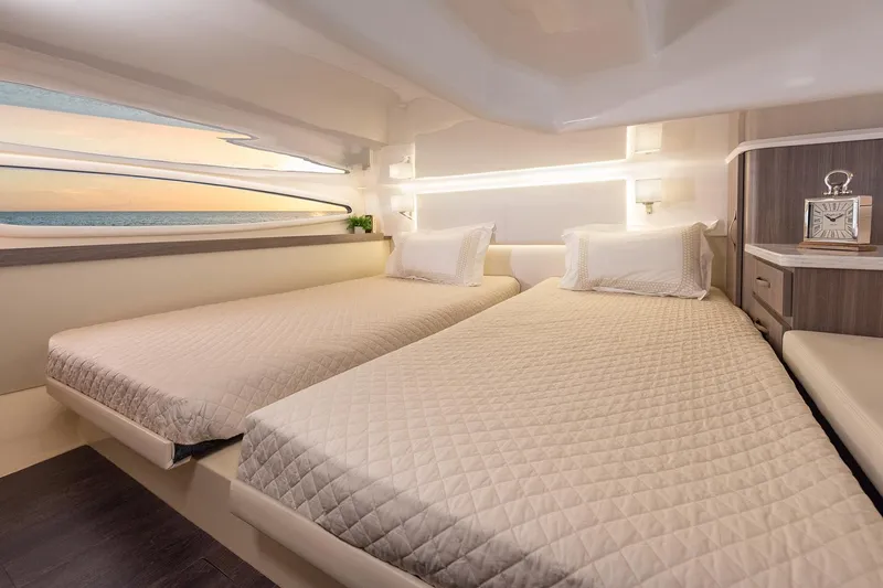 Slide: The Image of Manufacturer Provided Image: Luxurious cabin interior of 2025 Regal 38 FXO yacht with twin beds and modern design. - 114