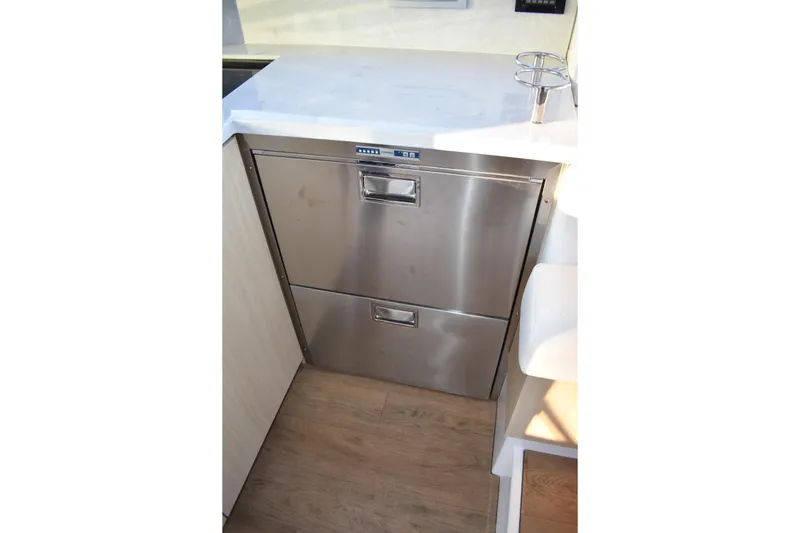 Slide: The Image of Stainless steel drawers in 2025 Regal 38 FXO yacht kitchen interior. - 24