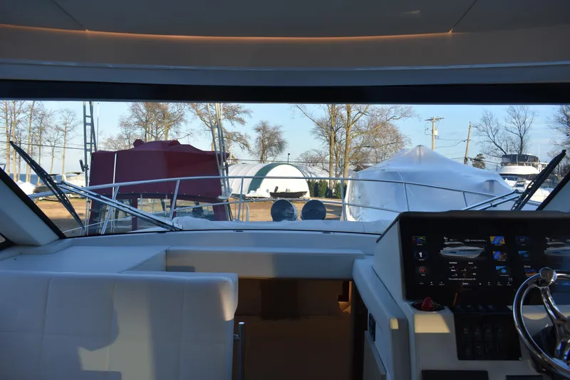 Slide: The Image of Interior view of 2025 Regal 38 FXO yacht cockpit with modern dashboard. - 30