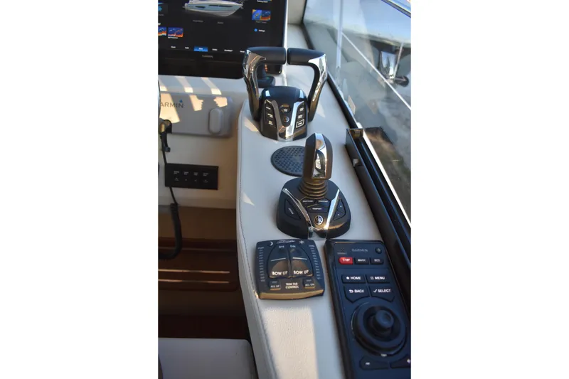 Slide: The Image of Control panel of 2025 Regal 38 FXO boat with advanced navigation systems. - 34