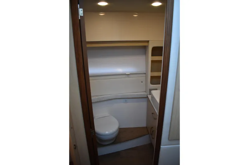 Slide: The Image of 2025 Regal 38 FXO yacht bathroom interior with modern fixtures and lighting. - 39