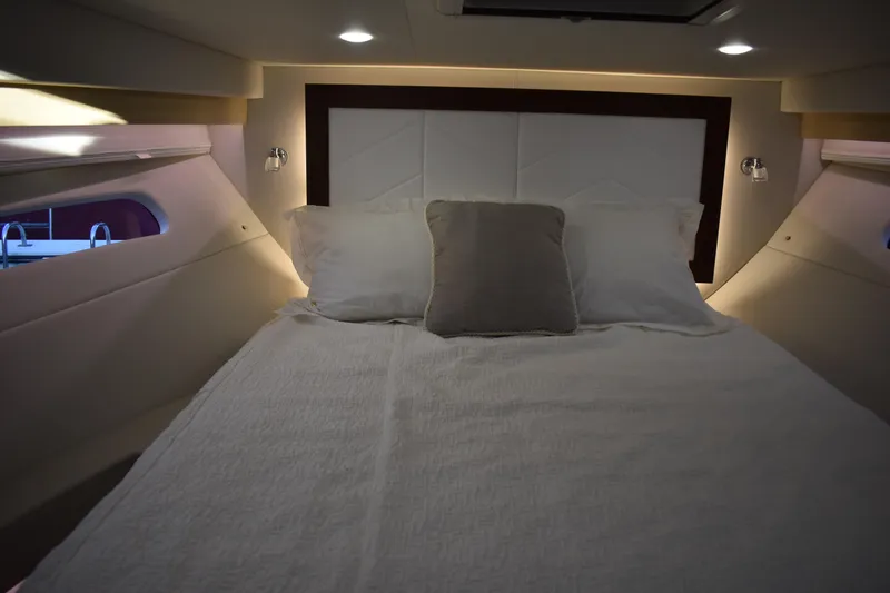 Slide: The Image of Luxurious cabin interior of 2025 Regal 38 FXO yacht with cozy bedding. - 46