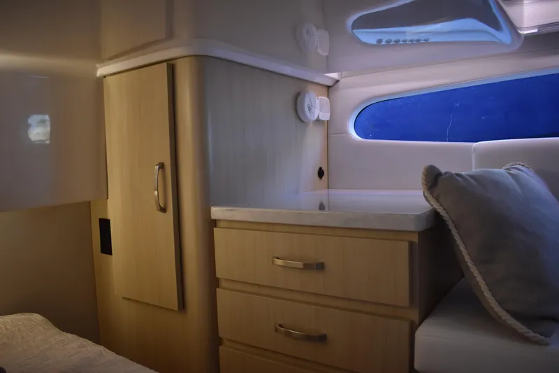Slide: The Image of Luxurious interior of 2025 Regal 38 FXO yacht with modern cabinetry and seating. - 51