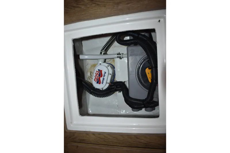 Slide: The Image of Bilge pump system in 2025 Regal 38 FXO boat, featuring Rule-Mate 1500 model. - 55