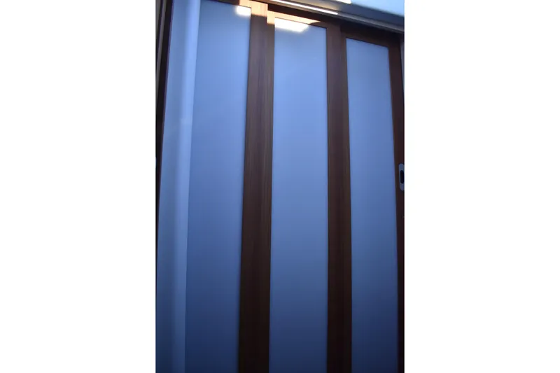 Slide: The Image of Sliding door detail on 2025 Regal 38 FXO yacht interior. - 61