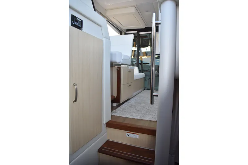 Slide: The Image of Interior view of 2025 Regal 38 FXO yacht, featuring modern design and comfortable seating. - 64