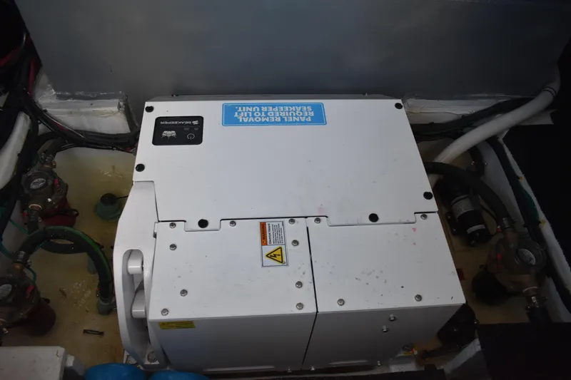 Slide: The Image of Engine compartment of 2025 Regal 38 FXO boat with Seakeeper stabilization unit. - 66