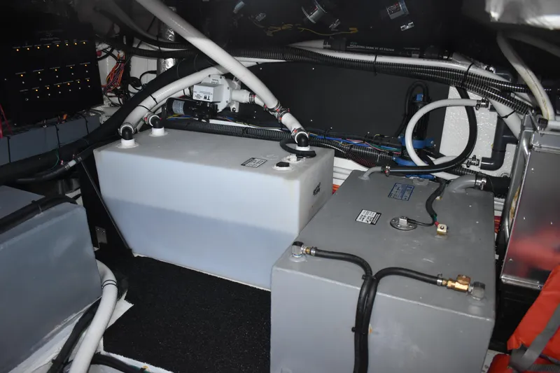 Slide: The Image of Engine room of 2025 Regal 38 FXO boat with tanks and wiring. - 68