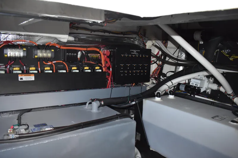 Slide: The Image of Engine room of 2025 Regal 38 FXO boat with electrical components and wiring. - 69