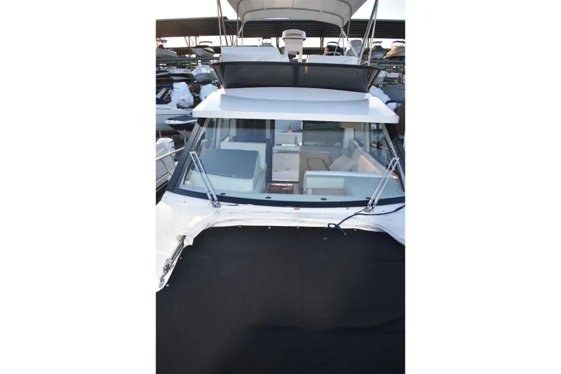 Slide: The Image of 2025 Regal 38 FXO yacht with sleek design and spacious interior at marina. - 78