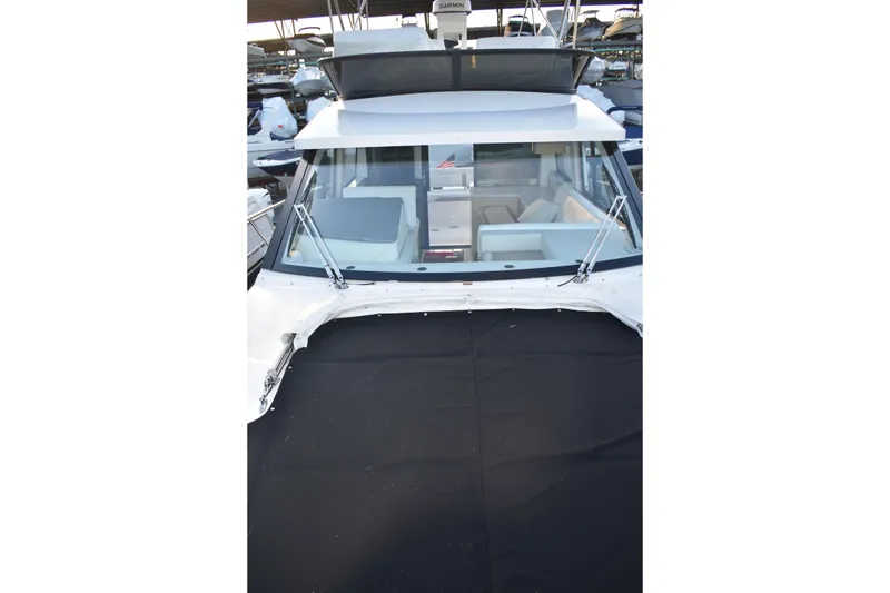 Slide: The Image of 2025 Regal 38 FXO boat with sleek design and spacious interior view. - 79