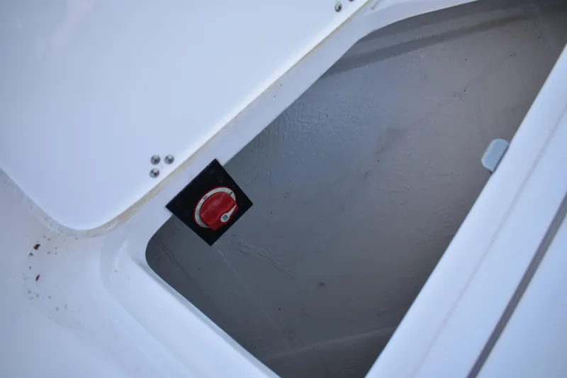 Slide: The Image of Hatch compartment with red switch on 2025 Regal 38 FXO boat. - 87