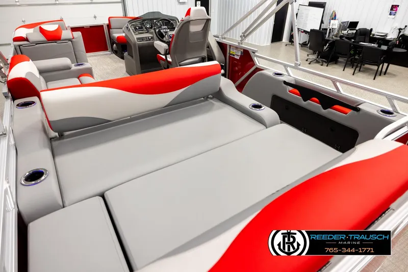 Slide: The Image of 2026 Avalon LSZ Vrl boat interior with red and gray seating, cup holders, and control panel. - 11