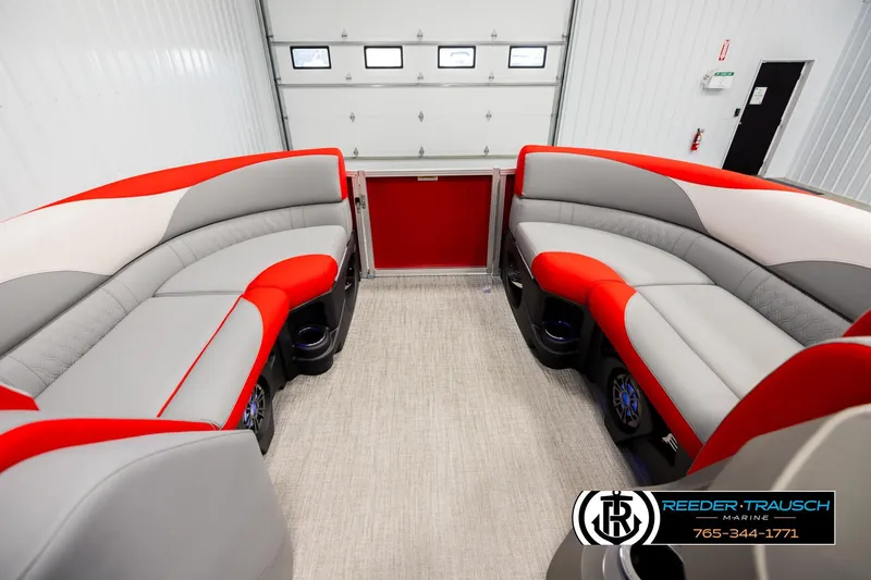 Slide: The Image of Interior of 2026 Avalon LSZ Vrl pontoon boat with red and gray seating. - 18