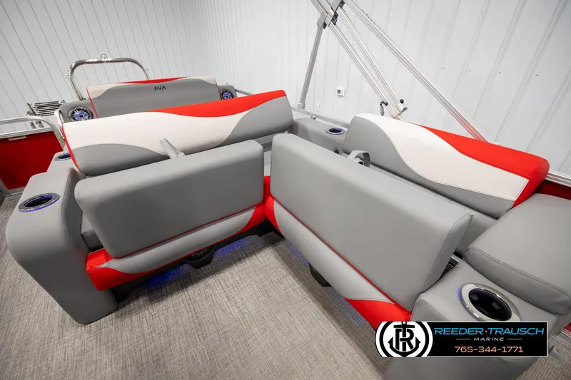 Slide: The Image of 2026 Avalon LSZ Vrl boat interior with modern gray and red seating, cup holders, and sleek design. - 22