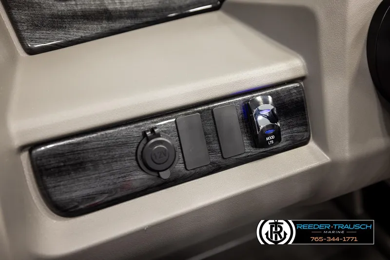 Slide: The Image of 2026 Avalon LSZ Vrl dashboard with 12V outlet and mood lighting switch. - 32