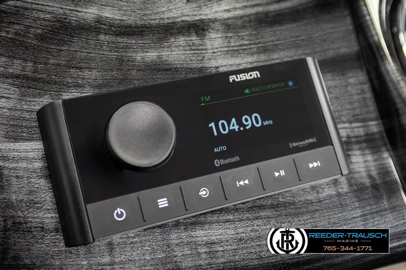 Slide: The Image of 2026 Avalon LSZ Vrl boat stereo system with Fusion display, featuring Bluetooth and FM radio. - 33