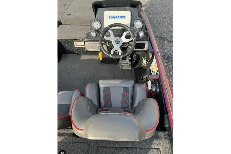 Slide: The Image of 2023 Nitro Z19 boat cockpit with steering wheel and Lowrance display. - 3