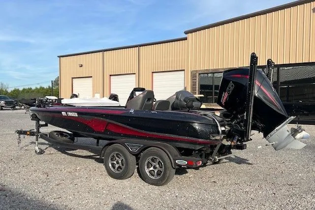 Slide: The Image of 2023 Nitro Z19 boat parked on gravel near a warehouse. - 6