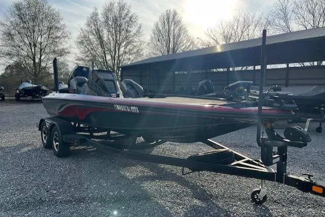 Slide: The Image of 2023 Nitro Z19 boat on trailer in outdoor storage area. - 8