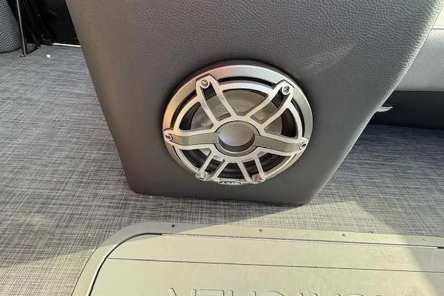 Slide: The Image of 2026 SunCatcher Diamond Elite 324 SL boat interior with steering wheel and Garmin display. - 14