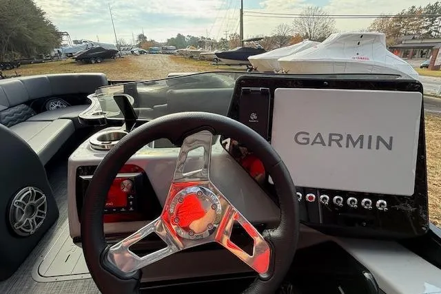 Slide: The Image of 2026 SunCatcher Diamond Elite 324 SL boat engine, surrounded by autumn leaves. - 15