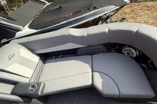 Slide: The Image of 2026 SunCatcher Diamond Elite 324 SL boat interior with gray seating and cup holders. - 18