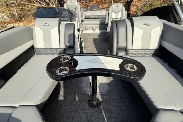 Slide: The Image of Interior view of 2026 SunCatcher Diamond Elite 324 SL boat with modern seating and steering. - 19