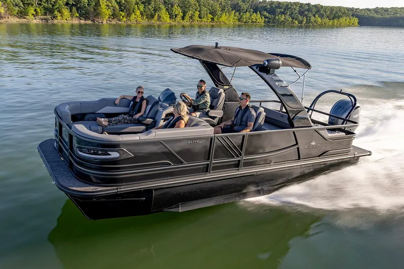 Slide: The Image of Manufacturer Provided Image: 2026 SunCatcher Diamond Elite 324 SL pontoon boat cruising on a serene lake. - 3