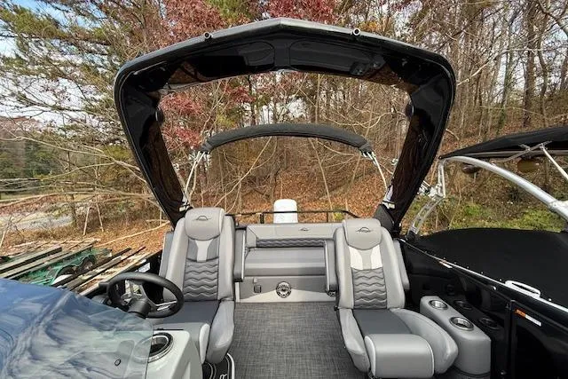 Slide: The Image of Manufacturer Provided Image: 2026 SunCatcher Diamond Elite 324 SL pontoon boat cruising on a serene lake. - 34