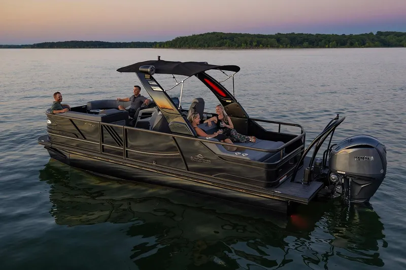 Slide: The Image of Steering wheel and dashboard of 2026 SunCatcher Diamond Elite 324 SL with Garmin display. - 5