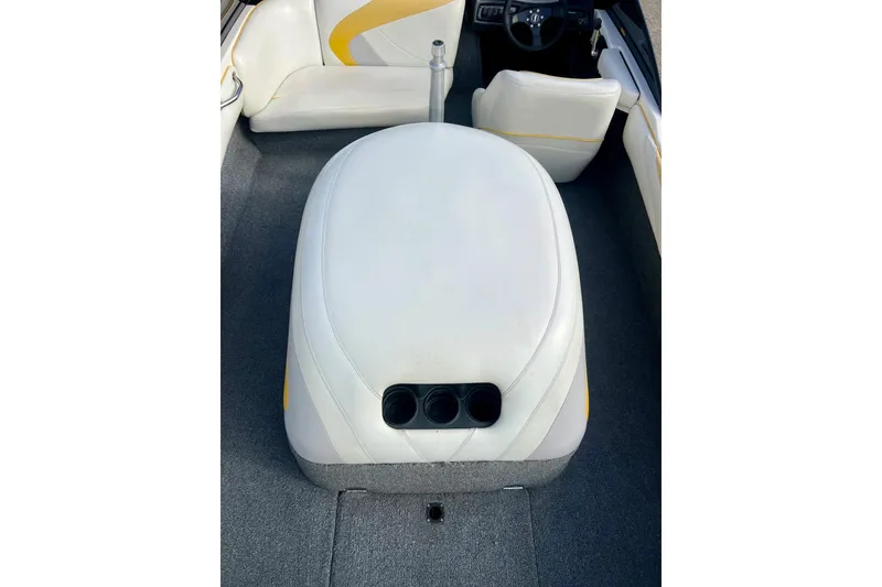 Slide: The Image of 2002 Malibu Sportster LX interior with white seating and cup holders. - 12