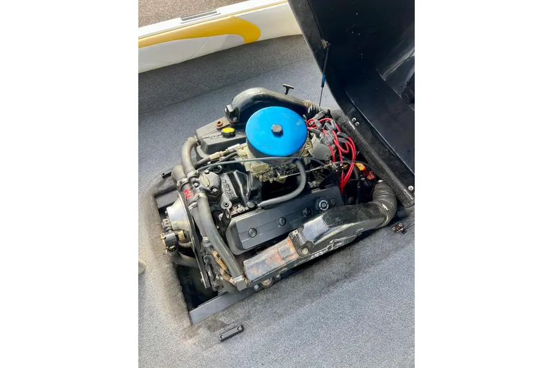 Slide: The Image of 2002 Malibu Sportster LX engine with blue air filter, detailed view. - 13