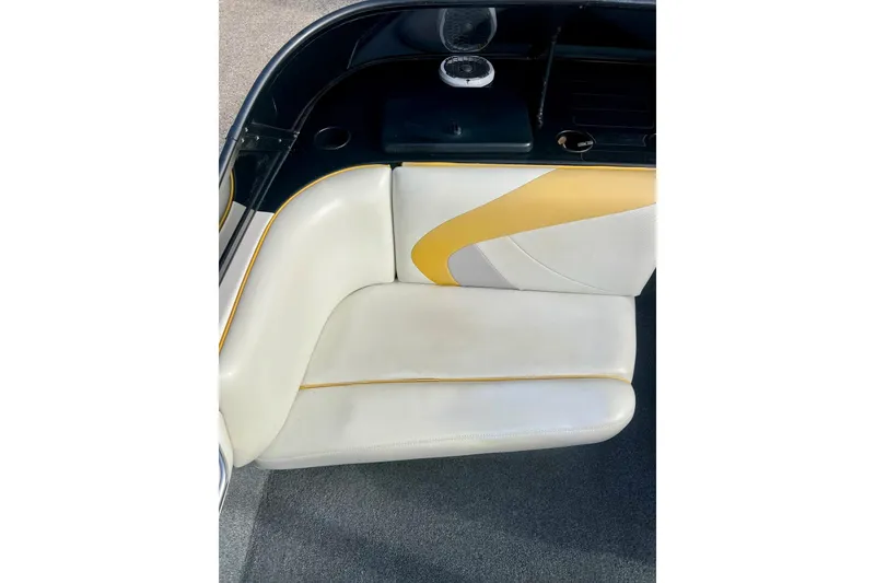 Slide: The Image of 2002 Malibu Sportster LX boat interior with white and yellow seating. - 14