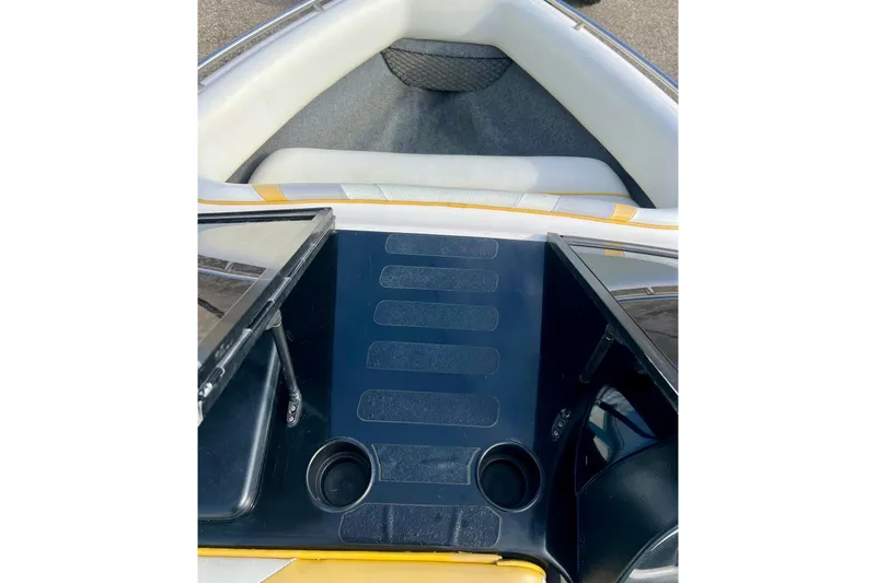 Slide: The Image of 2002 Malibu Sportster LX boat interior with seating and cup holders. - 17